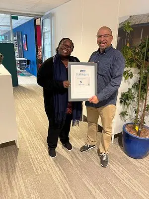 SafeCare Country Director Nigeria presenting the global certificate