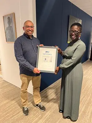 SafeCare Country Director Ghana presenting the global certificate