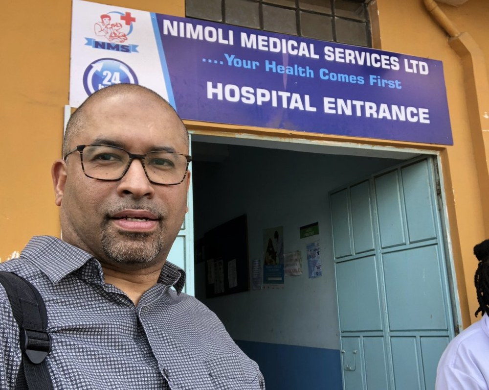Roy Wesenhagen at Nimoli Medical Services hospital entrance in Africa